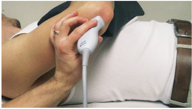 File:Patient positioning for olecranon bursa aspiration injection.jpg
